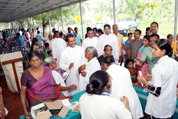 Flood hit kuttanadu turned flood lit : a joint endeavour Of kottayam social service sociey and caritas hospital.